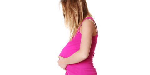 Side view of teen pregnant woman