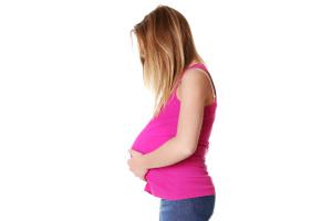 Side view of teen pregnant woman